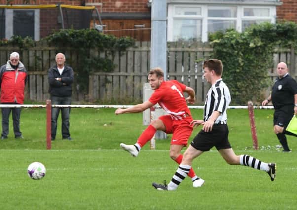 Ryhope CW (red) get in  a shot against Northallerton in the FA Vase. Picture by Kevin Brady