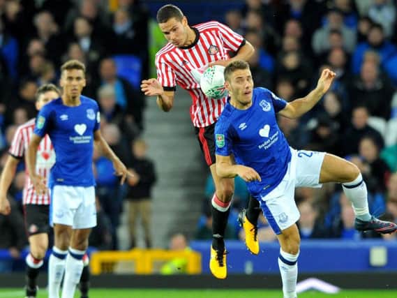Jack Rodwell challenges for the ball.