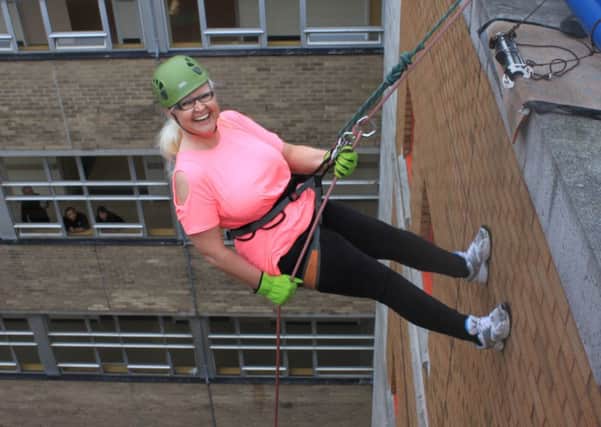 People taking part in a charity abseil at Sunderland Royal Hospital.