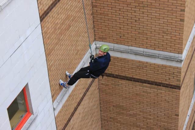 People taking part in a charity abseil at Sunderland Royal Hospital.