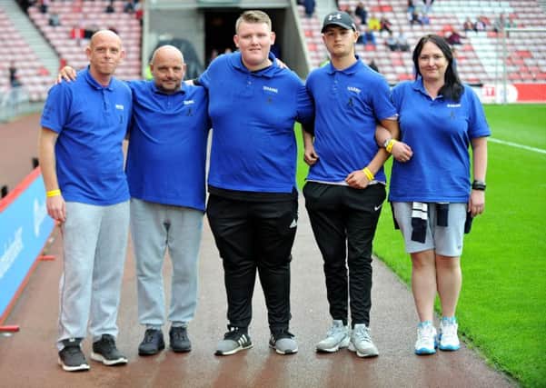 Shaine Tench (centre) with his back up crew arrive at The Stadium of Light after walking from Crewe in aid of The Bradley Lowery Foundation. Picture by FRANK REID