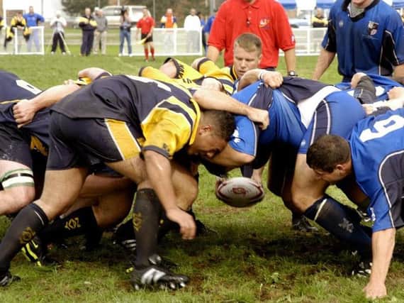 Experts say scrums and tackling should be banned in school rugby, as children risk being seriously injured.