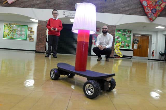 Richard Avenue Primary School pupil Gabriel Coates, 10 who designed a lamp on wheels. 
Artist maker Chris Folwell