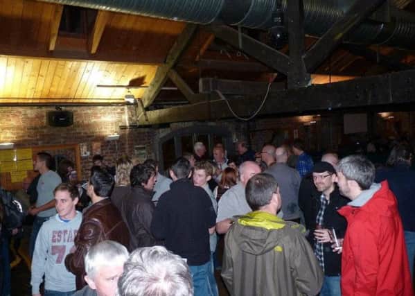 Drinkers enjoy a previous beer festival.