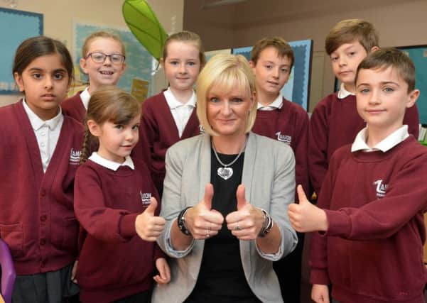 Lambton Primary School headteacher, Amanda Defty, and some of the pupils celebrate latest success.