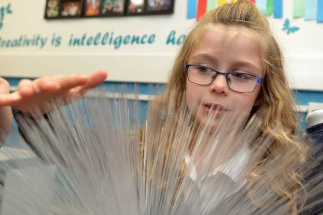 Pupil Sarah Boyd, 7, takes a look at the new Rainbow Room at Springwell Village Primary School.