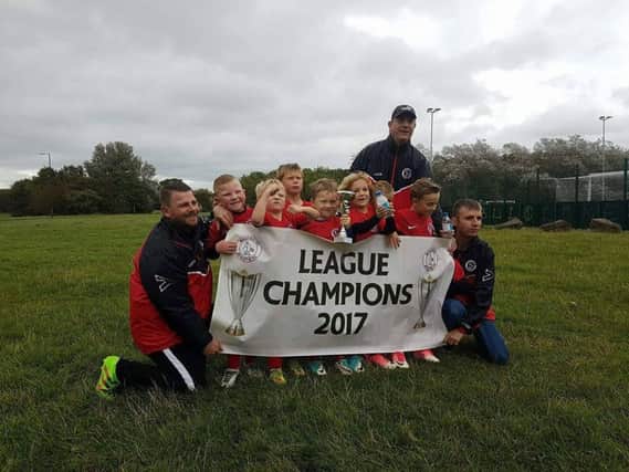 Washington Athletic Blacks celebrate winning the under 7s league. Picture courtesy of Kevin Mewes.