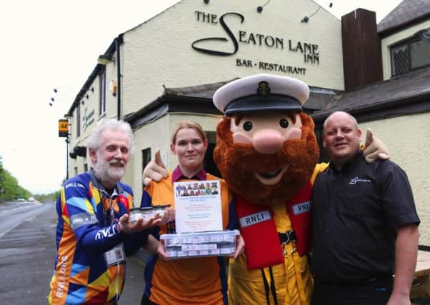 From left David Hastings, Joanne Curtis and Paul Brown with RNLI mascot Stormy Stan.