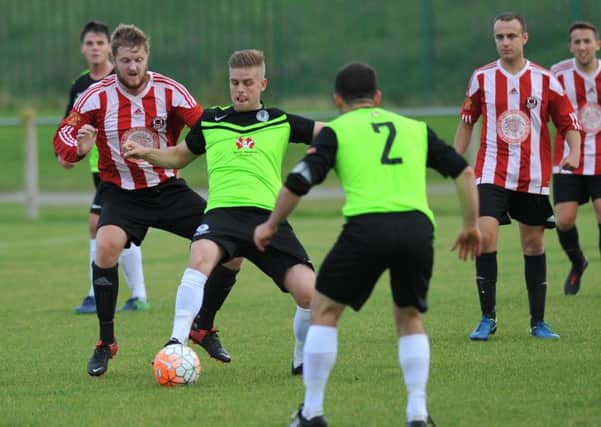 Sunderland West End (red) and Silksworth CW battle earlier this season