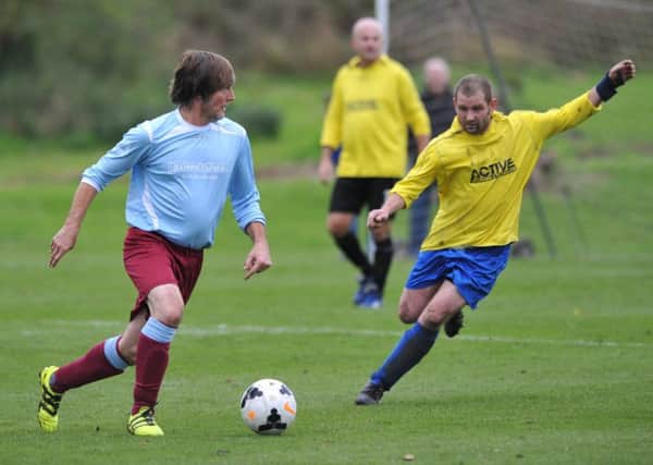 Wearmouth CW Old Boys (blue) look to create an opening against Pennywell Comrades last weekend.