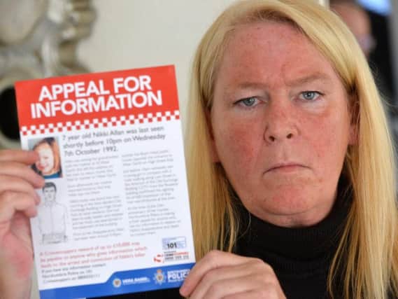 Sharon Henderson with one of the new leaflets police will be distributing to fans this weekend