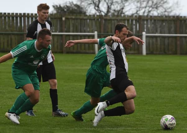Easington Colliery (green) take on Alnwick Town on Saturday. Picture by Kevin Brady