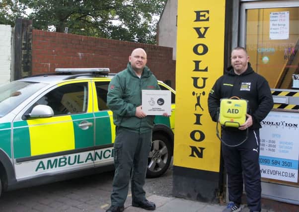 Paramedic Andy Thomas (left) from CIPHER Medical (Who have supplied the AED) and right Michael Donkin, managing director of Evolution Fitness.