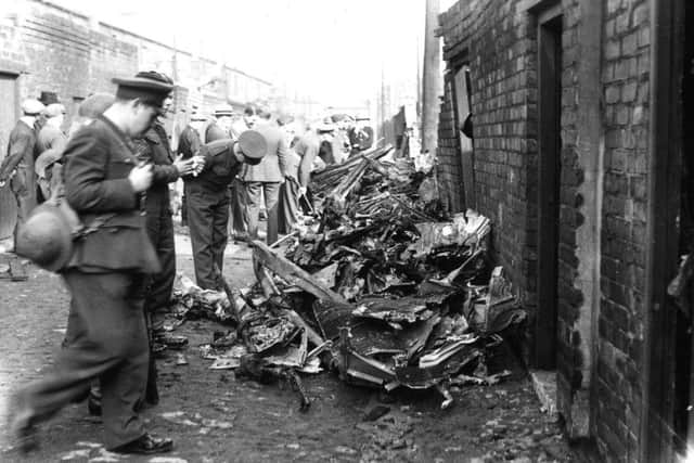 The undercarriage of the crashed bomber in the back lane of Suffolk Street