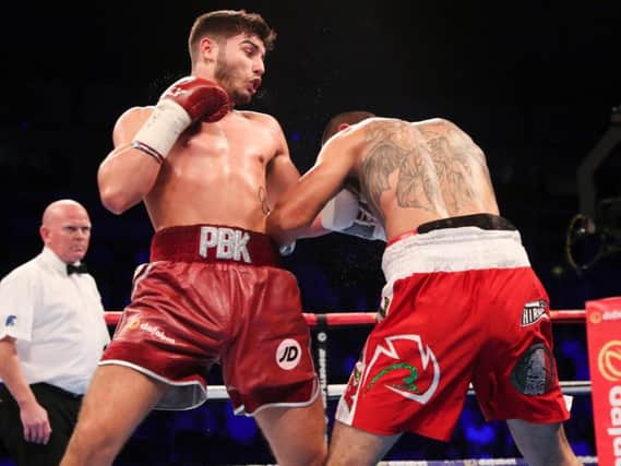 Josh Kelly drives a left into Jos Luis Ziga in Belfast. Picture by  Lawrence Lustig/Matchroom