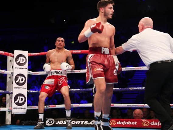 Josh Kelly leaves Jos Luis Ziga hurt on the ropes. PIcture by LAWRENCE LUSTIG/ MATCHROOM