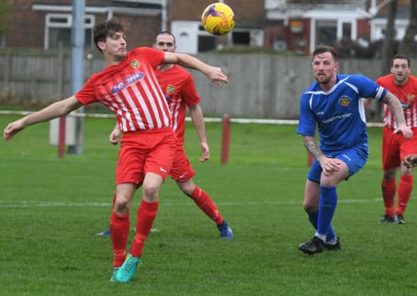 Ryhope CW (red/white) take command against Harrogate RA in Saturday's FA Vase clash. Picture by Kevin Brady