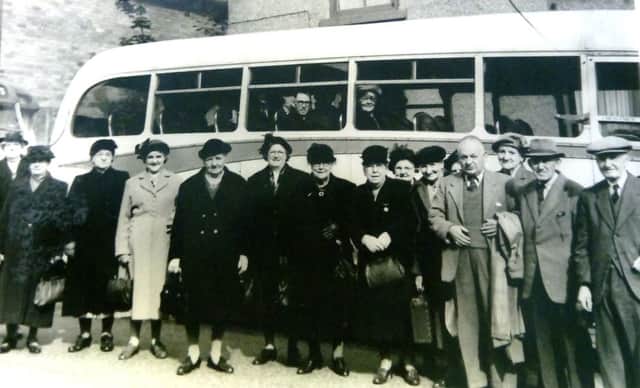 Grace, pictured third right, is ready to go on a bus trip.