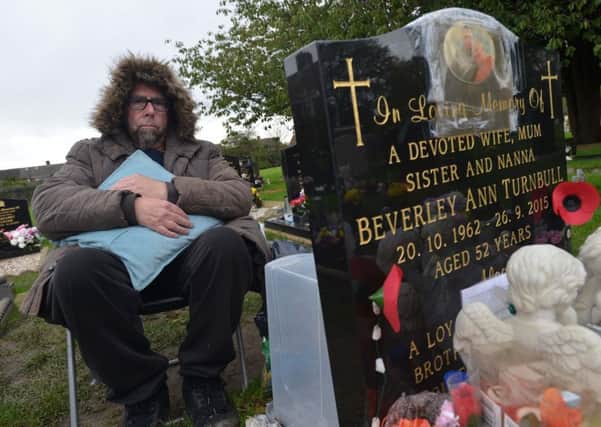 George Turnbull has taken to sleeping at his wife and parents' graves following grave theft
