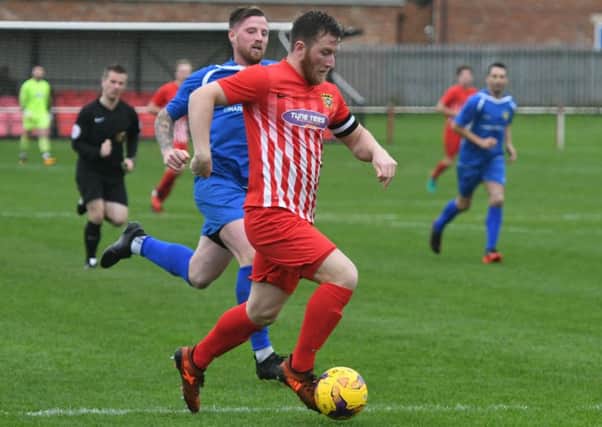 Kyle Davis drives forward for Ryhope CW (red/white) in last week's FA Vase hammering of Harrogate RA. Picture by Kevin Brady