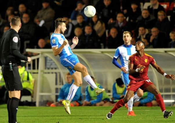 Hartlepool United midfielder Lewis Hawkins gets in a header against Tranmere Rovers. Picture by Frank Reid