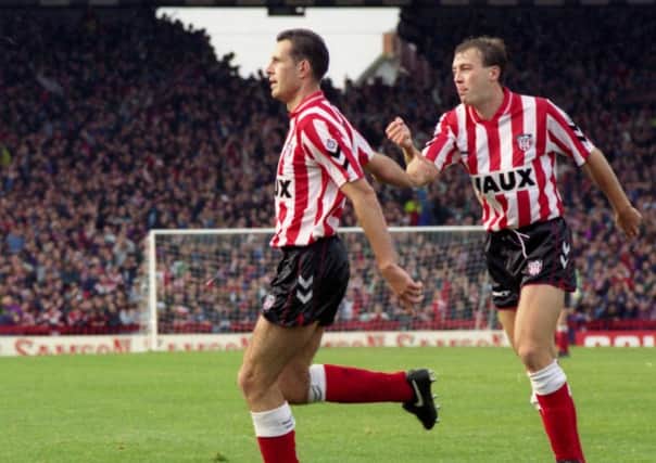 Lee Howey celebrates scoring at Roker Park with Gary Owers ready to give him a helping hand.