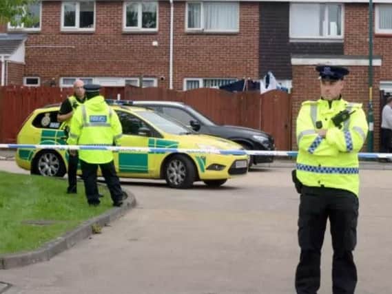 Police officers and paramedics at the scene of the killing of Gemma Finnigan in Church View, Boldon Colliery