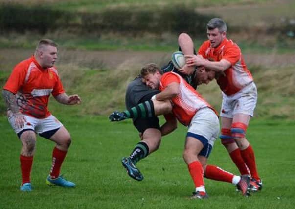 Seaham (red) get stuck in against Blyth on Saturday.
