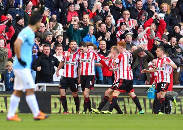 Sunderland's Phil Bardsley (back, left) celebrates scoring against Man City.