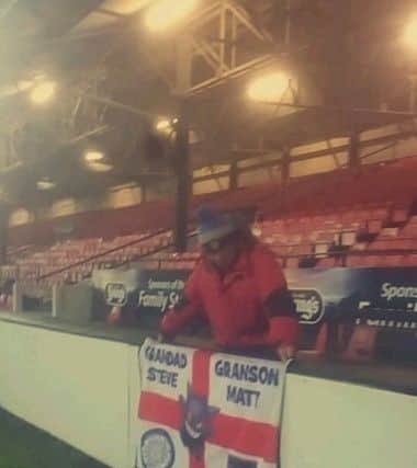 Steven Thompson with his and grandson Matthew's flag at the Grimsby Town v Sunderland game.