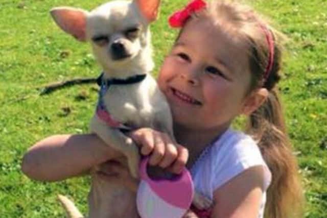 Laura's daughter Ellie with their pet chihuahua Molly