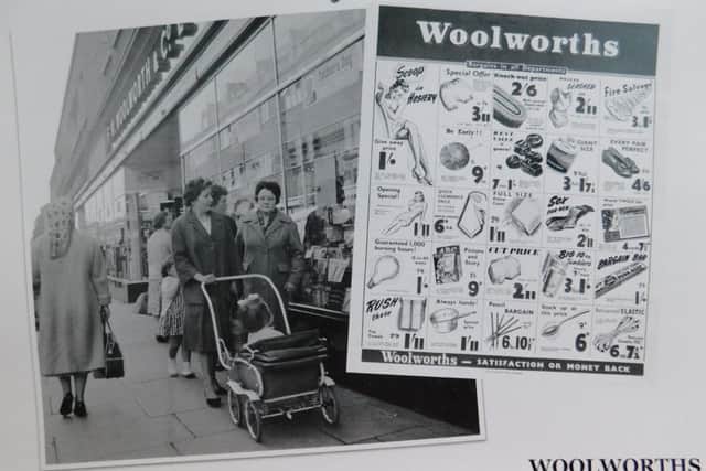 An advert and photo of the former Woolworths store. Remember this?