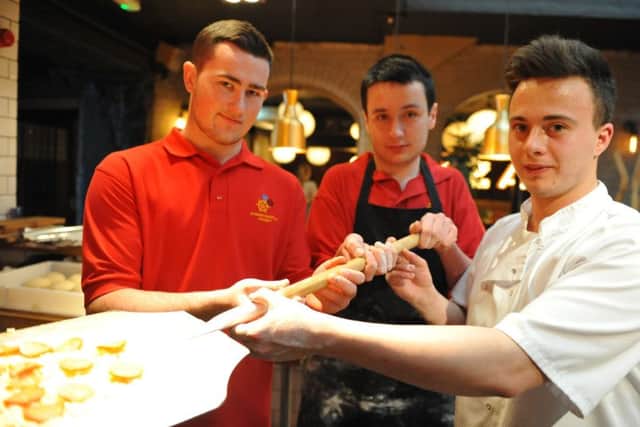 Barbara Priestman School pupils are helped by Roker Hotel Italian Farmhouse chef John Ward.