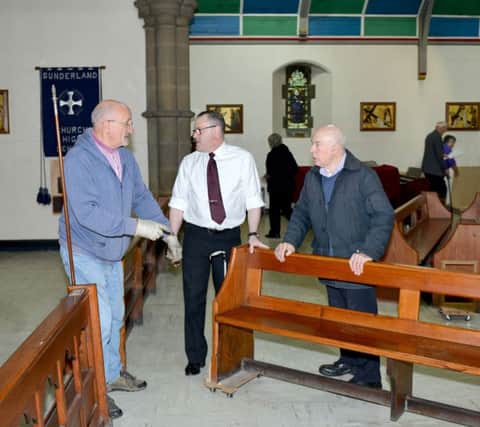 John Hogg funeral service staff and members of St Ignatius Church move pews and install table tops to make the church ready for its annual fair.