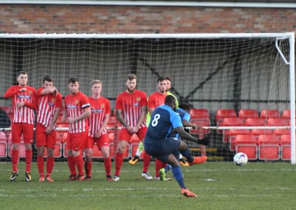 Andrew Mogwo curls home Washington's opener from a free-kick in Saturday's win at Ryhope CW. Picture by Kevin Brady