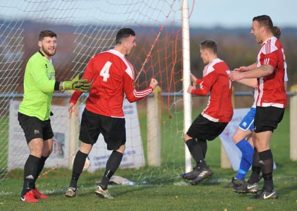 Sunderland West End (red/white) celebrate equalising against  Redcar Athletic on Saturday. Picture by Tim Richardson