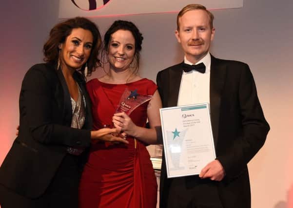 Zoe King, centre, receives her award from TV personality Saira Khan.