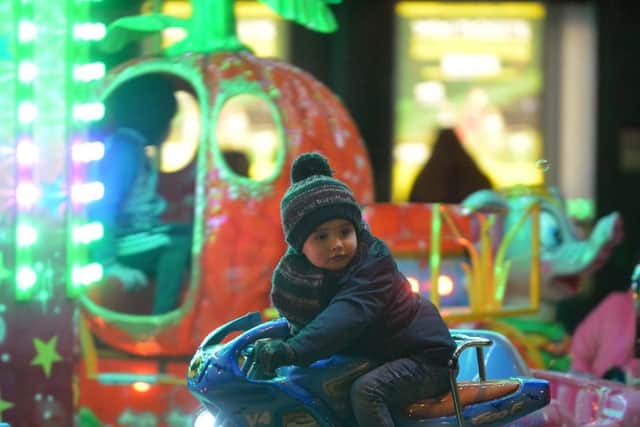 Flynn Dennis, 4, enjoys the rides