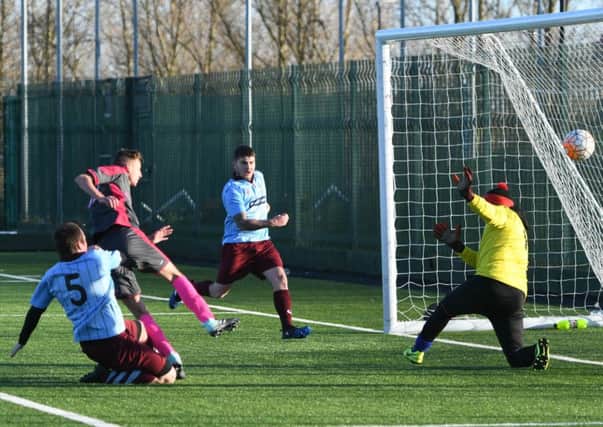 Pennywell Comrades Club (grey) score their second goal against Hendon Athletic last week. Picture by Kevin Brady