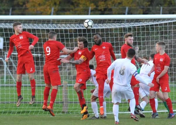Consett's Danny Craggs sends in a free-kick, deflected for a corner, by a Washington wall featuring ex-Sunderland defender Pascal Chmbonda. Picture by Tim Richardson.