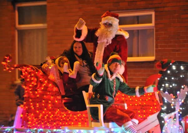 Chloe Gray arrives on Santa's Sleigh to switch on the Christmas lights in Pallion, Sunderland.