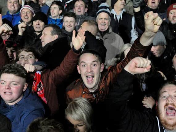 Sunderland fans celebrate at Burton Albion.