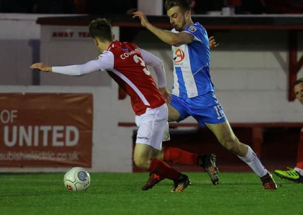 Pools' Rhys Oates (right) takes on Ebbsfleet's Jack Connors on Saturday.