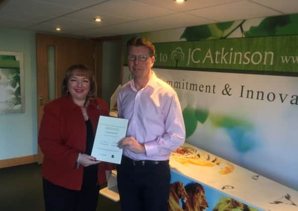 Sharon Hodgson presents Julian Atkinson with the certificate