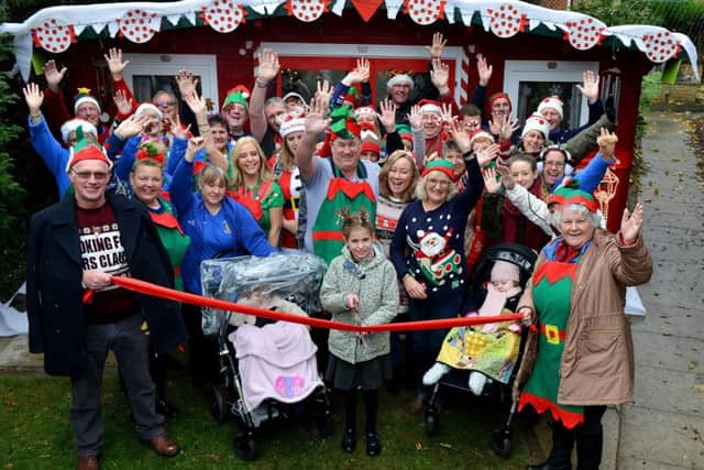 Caitlyn Sivewright (9) cuts the ribbon to open the Playhouse in the grounds of Zoe's Place Baby Hospice. Picture by FRANK REID