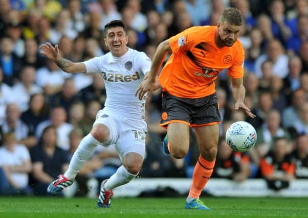 Reading's Joey van den Berg (right) gets away from Leeds' Pablo Hernandez last month. Picture by Tony Johnson.