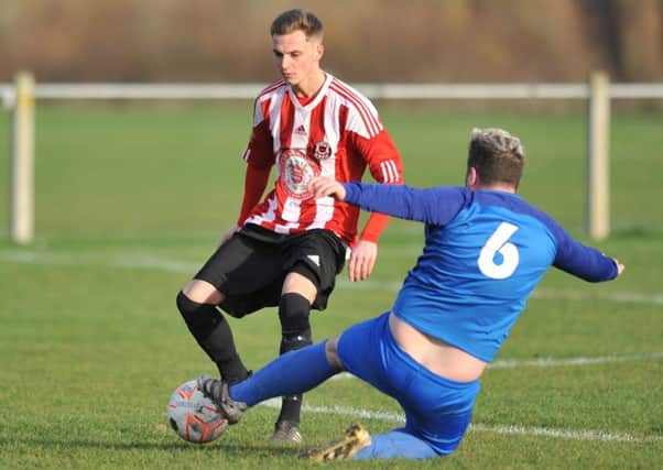 Sunderland West End (stripes) take on Windscale in last week's 10-0 romp. Picture by Tim Richardson