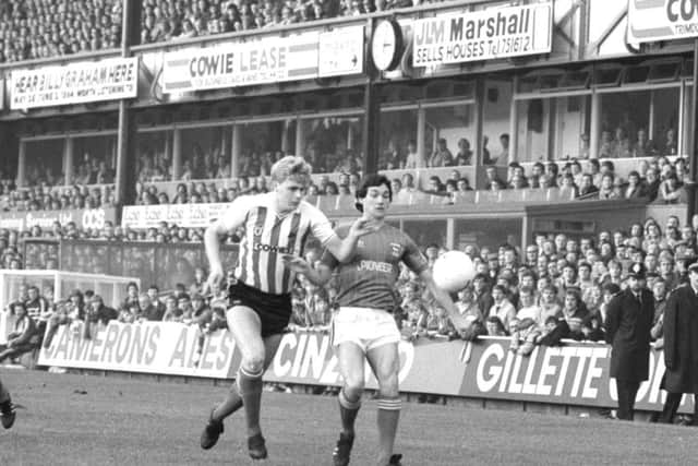 Colin West battles it out with George Burley
