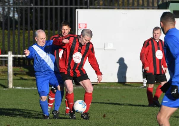 Plains Farm Alldec (red/black) take on Newcastle East End in the Over-40s League last weekend. Picture by Kevin Brady