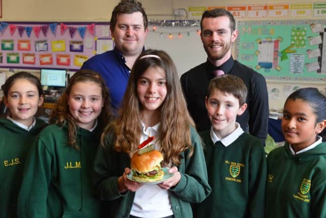 Hill View Academy pupil Abigail Dobson, 10 healthy burger winner with runner up children.
Back from left Stirks Butchers owner John Stirk and head waiter Darryl Howard
